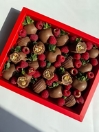Fatima Box – milk chocolate strawberries topped with raspberries, truffles, and gold accents, bold Dubai gift box