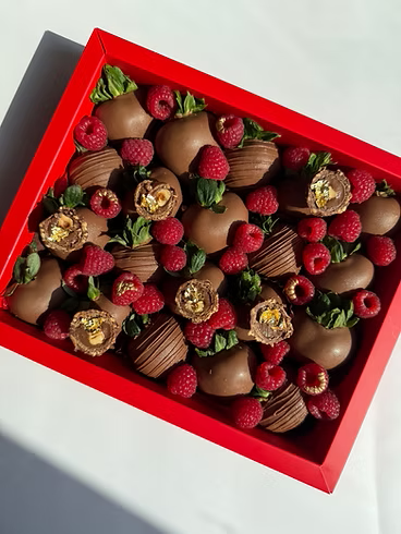 Fatima Box – milk chocolate strawberries topped with raspberries, truffles, and gold accents, bold Dubai gift box