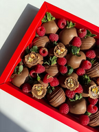 Fatima Box – milk chocolate strawberries topped with raspberries, truffles, and gold accents, bold Dubai gift box