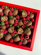 Fatima Box – milk chocolate strawberries topped with raspberries, truffles, and gold accents, bold Dubai gift box